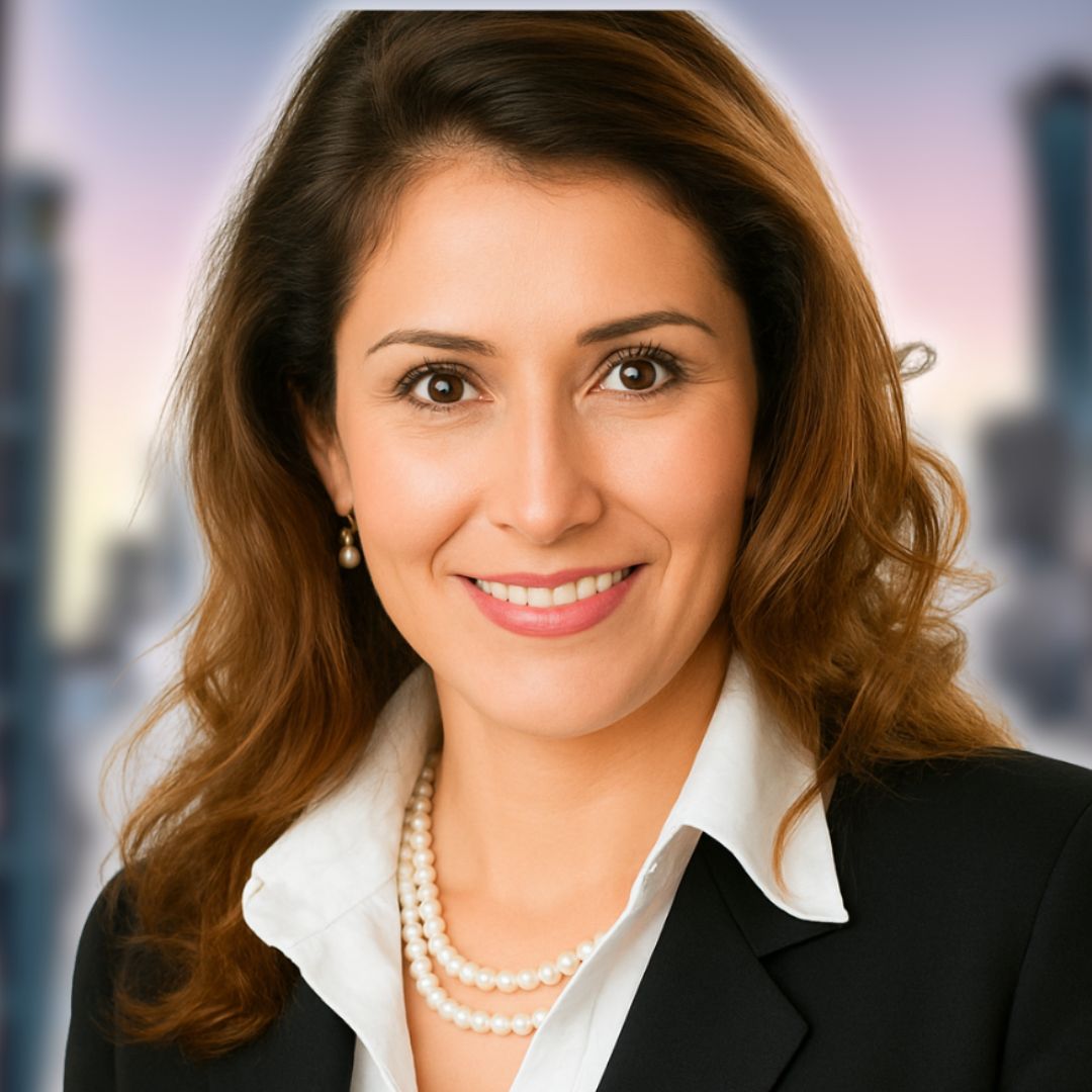 Professional woman smiling in a business suit, representing intuitive life coaching and mentorship for personal growth and clarity.