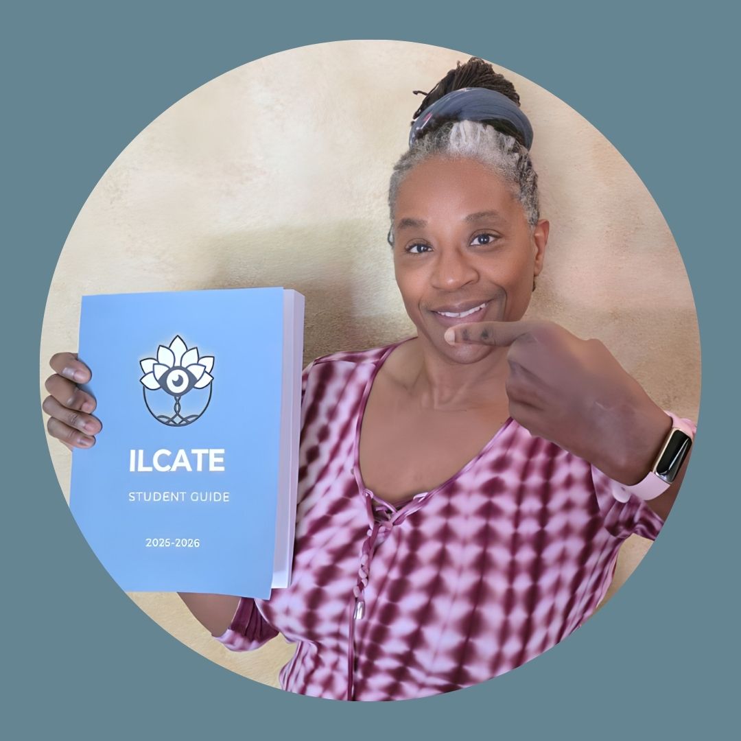 Woman holding ILCATE Student Guide for 2025-2026, smiling and pointing, showcasing community support in coaching journey.